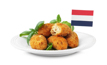 Tasty fried croquettes, flag of Netherlands and basil isolated on whiteの写真素材