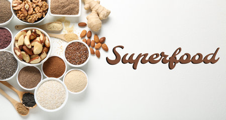 Superfood. Different powders and food products on white background, flat lay. Banner designの写真素材