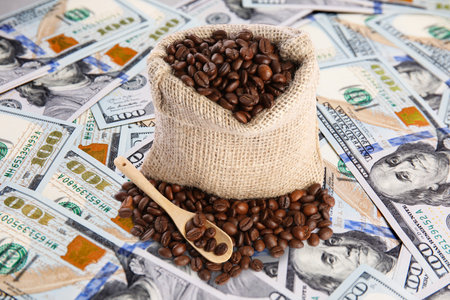 Coffee price rising. Dollars and roasted coffee beans