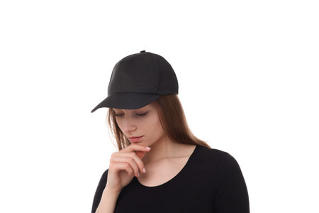 Young woman wearing stylish black baseball hat on white backgroundの写真素材