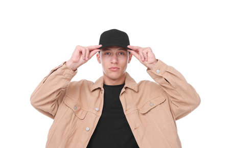 Young man wearing stylish black baseball hat on white background