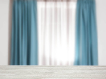 Empty white wooden table against window with curtains in roomの写真素材