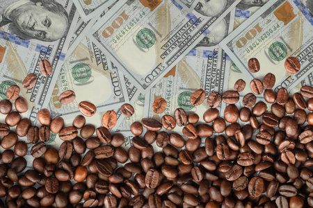Coffee price rising. Dollars and roasted coffee beansの写真素材