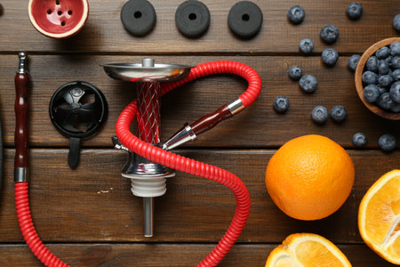 Flat lay composition with traditional hookah parts on wooden tableの写真素材
