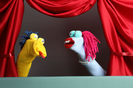 Creative puppet show on stage with red curtainsの写真素材