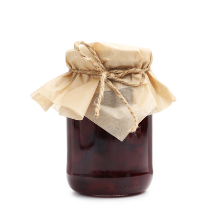 Tasty cherry jam in jar isolated on whiteの写真素材