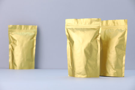 Zipper stand-up pouches on light gray background. Mockup for design