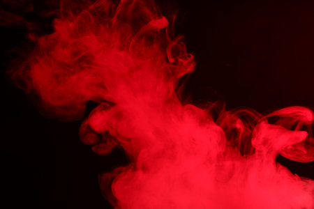 Hookah smoke in red light on black background, closeupの写真素材