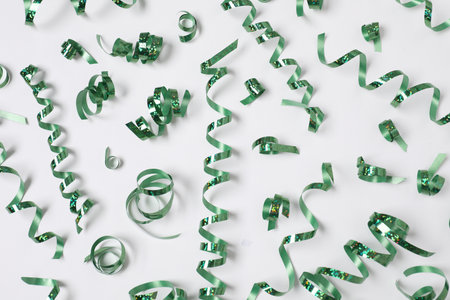 Shiny party streamers on white background, flat layの写真素材