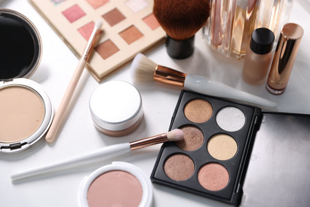 Different makeup products on white table, above viewの写真素材