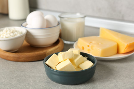 Different dairy products and eggs on gray textured table in kitchen, closeupの写真素材