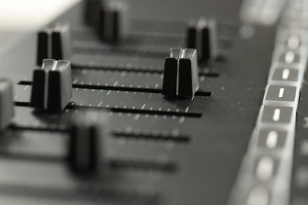 One portable MIDI keyboard with faders, closeup