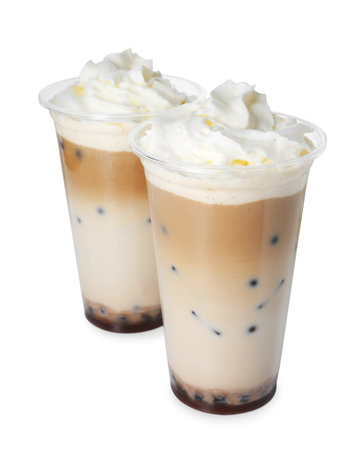 Tasty milk bubble tea in plastic cups isolated on whiteの写真素材