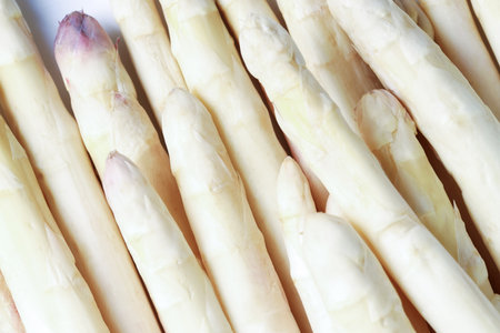 Raw white asparagus spears as background, closeupの写真素材
