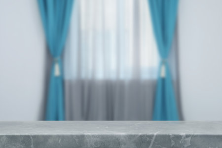 Empty stone table against window with curtains in roomの写真素材