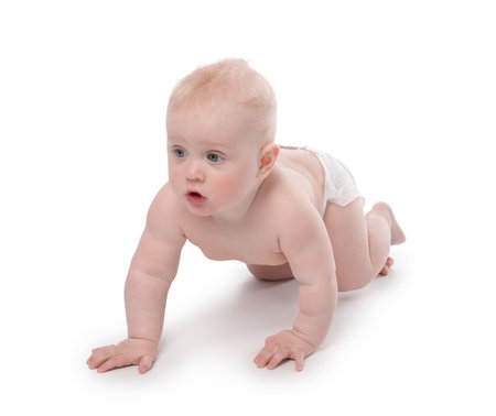 Cute little baby crawling on white backgroundの写真素材
