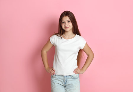 Portrait of teenage girl on pink backgroundの写真素材