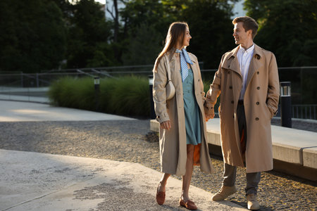 Lovely couple walking together on city street, space for textの写真素材