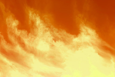 Orange sky with clouds during hot summer weather