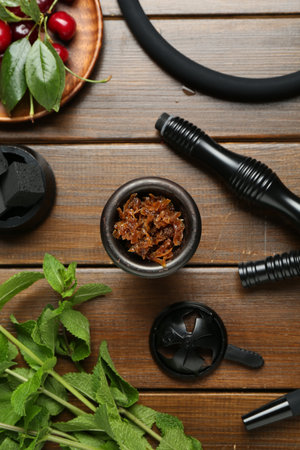 Flat lay composition with traditional hookah parts on wooden tableの写真素材