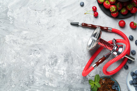 Hookah and fresh fruits on gray table, flat lay. Space for textの写真素材