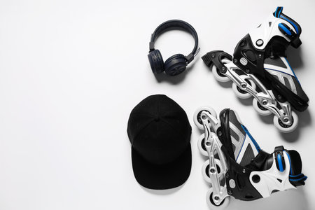 Flat lay composition with roller skates on white background. Space for textの写真素材