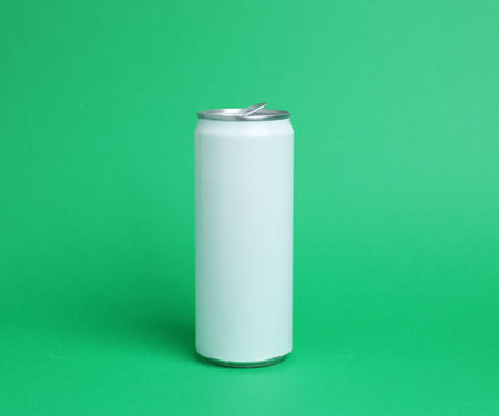 One white tin can on green backgroundの写真素材