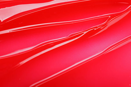 Texture of red lip gloss as background, top viewの写真素材