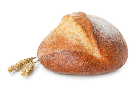 Loaf of fresh bread and spikes isolated on whiteの写真素材