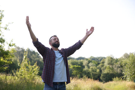 Feeling freedom. Man enjoying time outdoors. Space for text