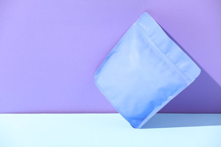 Zipper stand-up pouch on color background, mockup for design