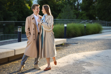 Lovely couple walking together on city street, space for textの写真素材