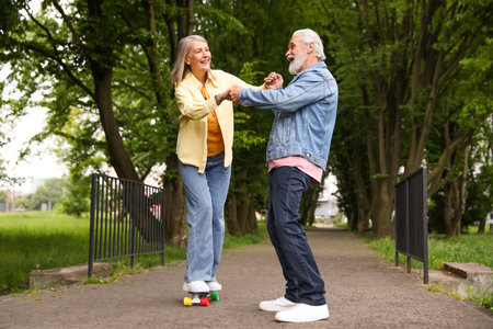 Lovely senior couple having fun together in parkの写真素材