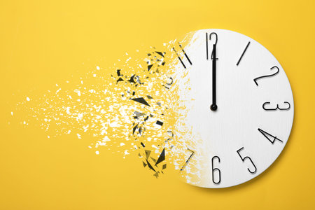 Time running out. Clock dissolving on orange background