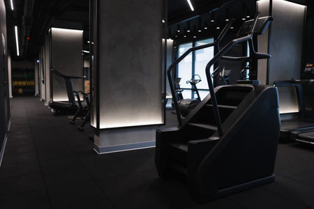 Professional stair climber machine in gym, space for text