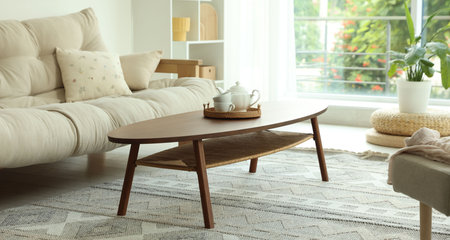 Coffee table, sofa and decor in dining room. Interior design