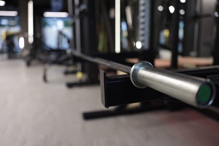 Professional barbell and other equipment in gym, closeup. Space for textの写真素材