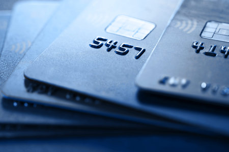 Many different credit cards on table, closeup