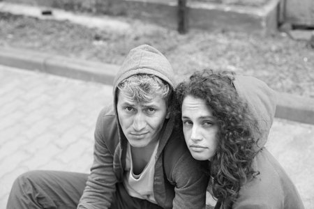 Portrait of homeless people outdoors. Black and white effectの写真素材