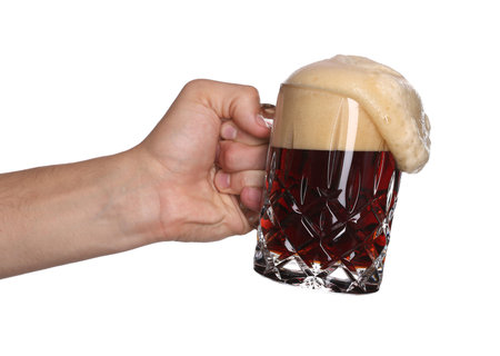 Man with glass mug of tasty beer on white background, closeup