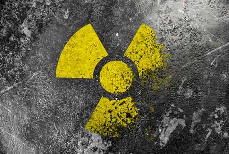 Radioactive sign on gray textured surface. Radiological pollutionの写真素材