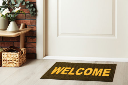 Welcome mat on floor near door in roomの写真素材