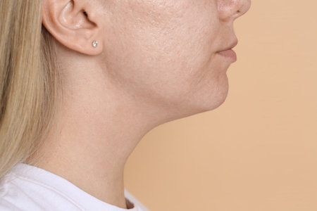 Closeup view of woman on beige background, space for textの写真素材