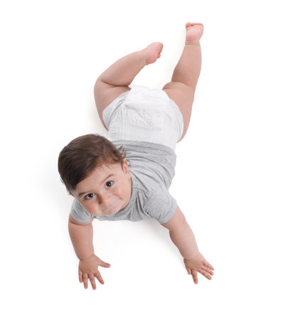 Cute little baby crawling on white background, above viewの写真素材