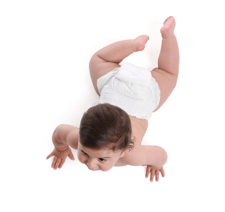 Cute little baby crawling on white background, above viewの写真素材