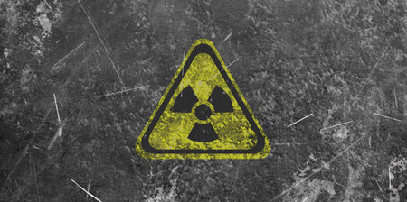 Yellow radioactive sign on gray textured background, banner design. Radiological pollutionの写真素材