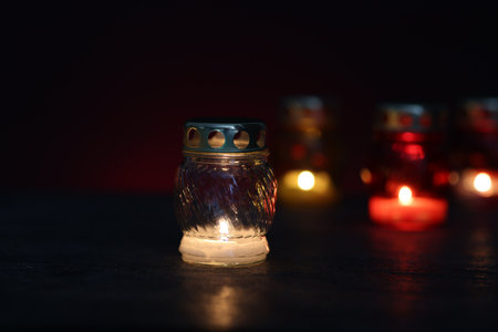 Many grave candles on dark background, closeupの写真素材