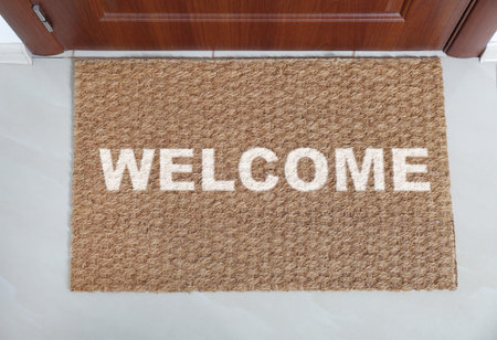 Welcome mat on floor near front door, top viewの写真素材