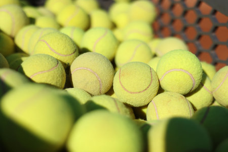 Many tennis balls in cart outdoors, closeupの写真素材