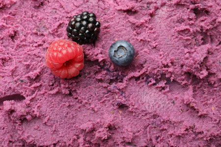 Delicious sorbet with berries as background, closeupの写真素材